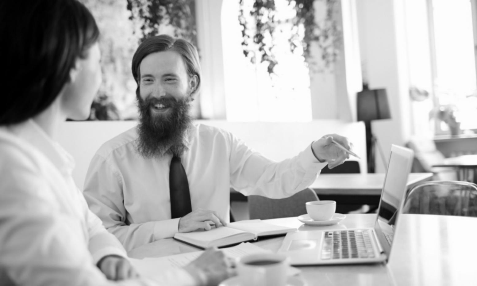 Professional using budget software on computer screen showing detailed expense tracking