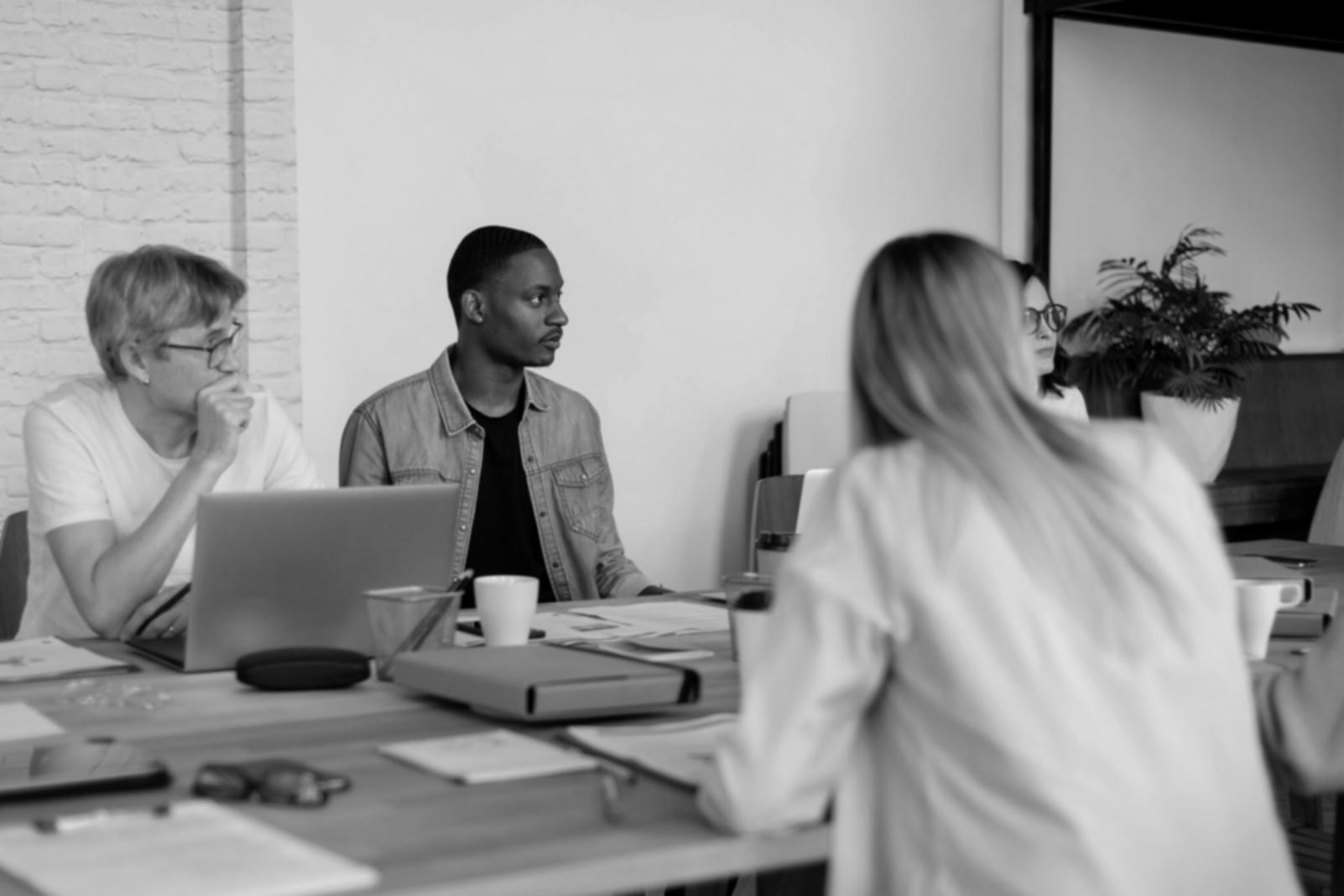 Vietnamese business meeting discussing local financial management practices