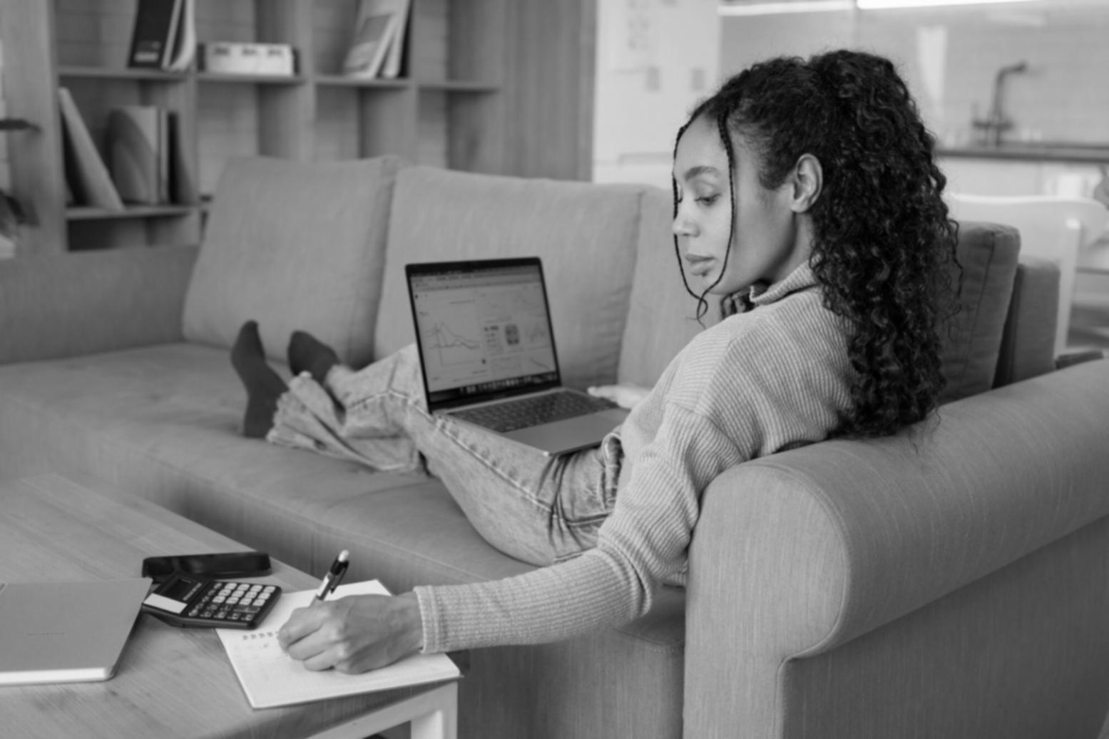 Team collaboration session with developers and designers working on financial software mockups